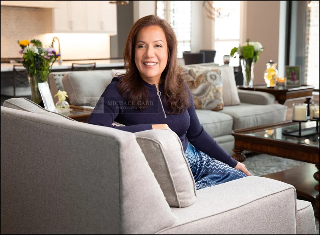 Relaxed lifestyle branding portrait of a businesswoman in a modern living space.