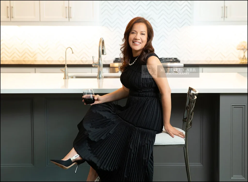 Lifestyle branding portrait of a businesswoman photographed in a contemporary kitchen.