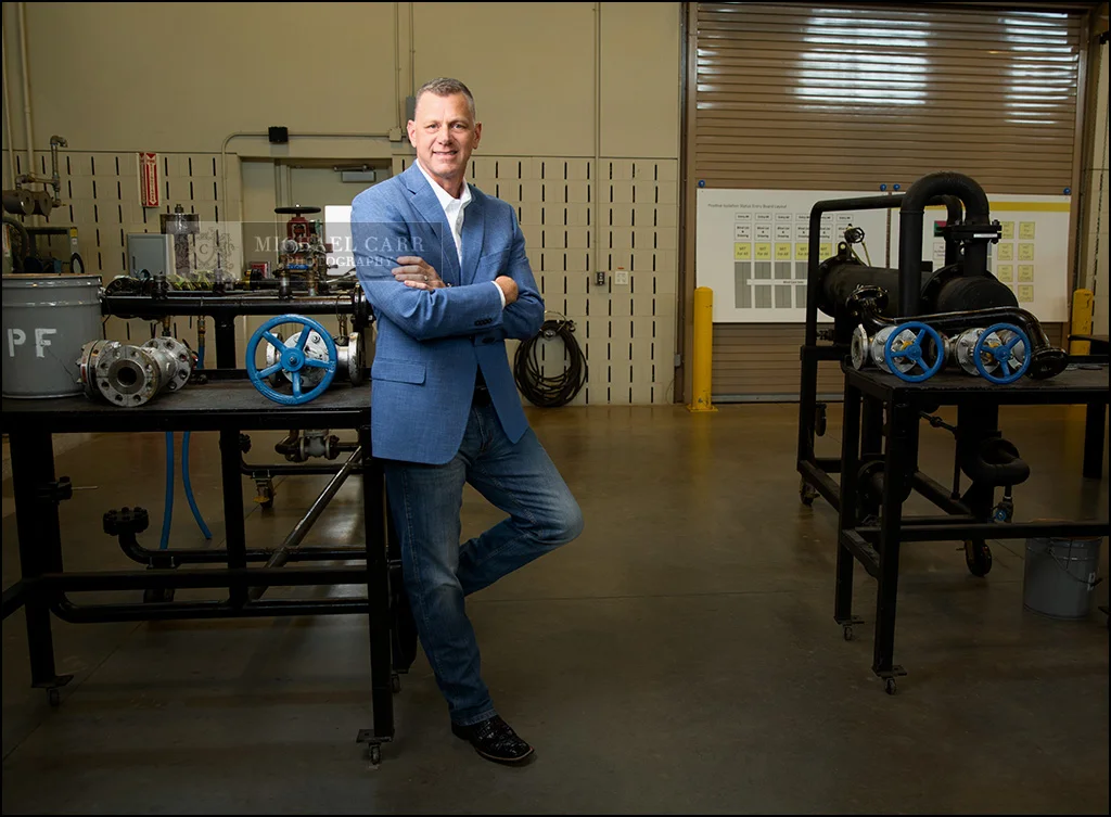 CEO photographed inside his manufacturing facility for executive personal branding.