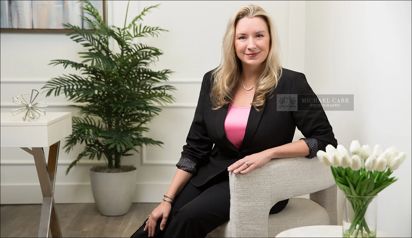Attorney seated in a contemporary office during a Houston personal branding photography session.