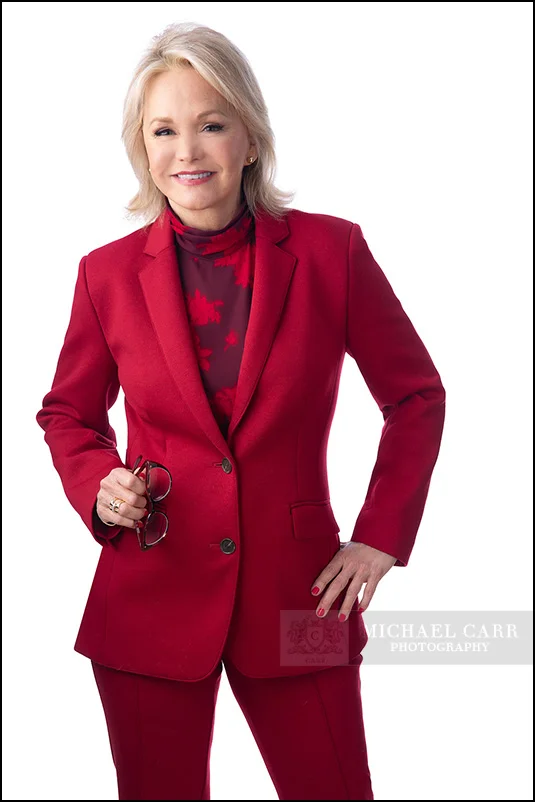 Attorney wearing a red suit photographed for a Houston personal branding session.